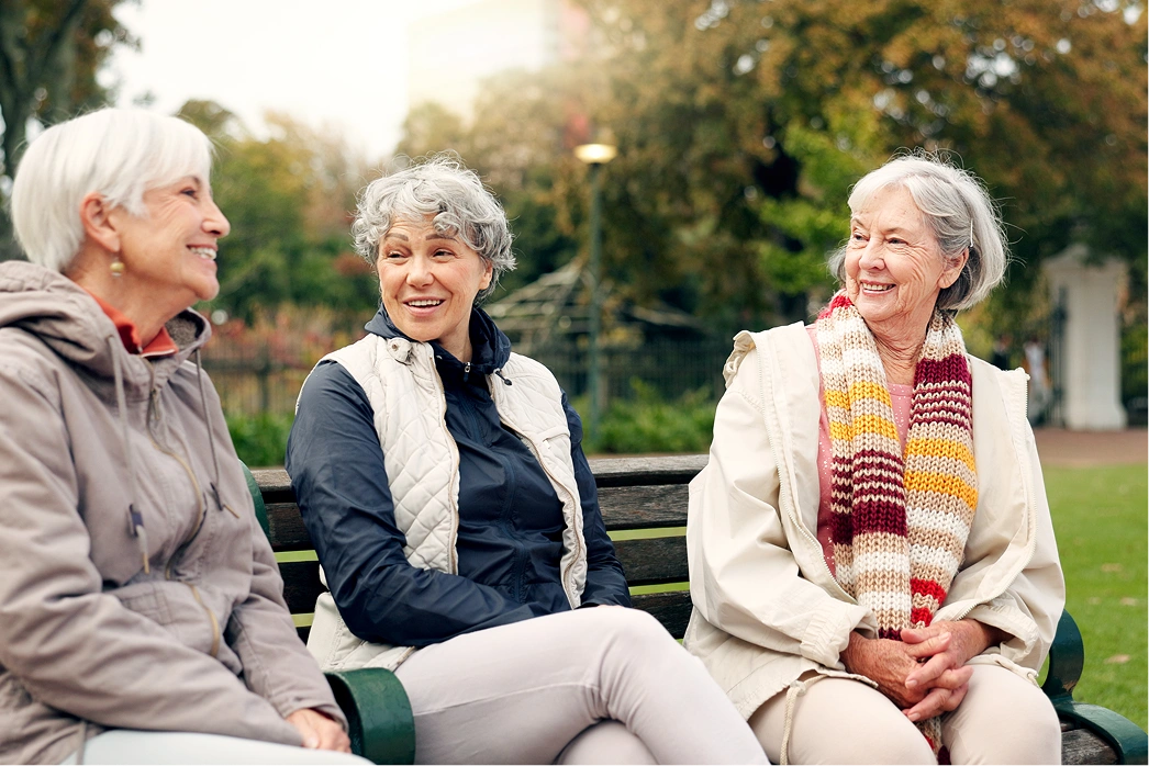 lovely-elderly-woman-talking-healthcare-specialist-home-visit-happy-satisfied-female-senior-holding-hands-with-nurse-enjoying-her-company-kindness-home-care-people-retirement 1