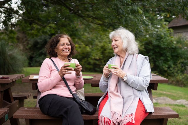two women on park bench