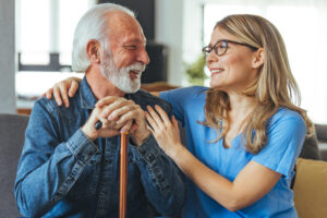 iStock-1494635137-min caregiver sitting providing companionship for older veteran