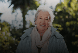 Untitled design (4) Smiling older woman outdoors, reflecting strength, dignity, and grace in daily health journey